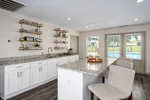 Kitchen with marble countertops at Arbours at Victoria Place Prattville AL