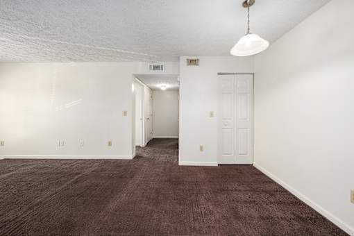 Room with carpet and neutral walls at Arbours at Victoria Place Prattville AL