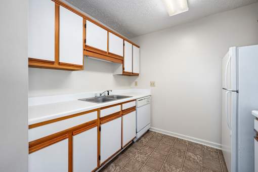 Kitchen with white cabinets at Arbours at Victoria Place Prattville AL