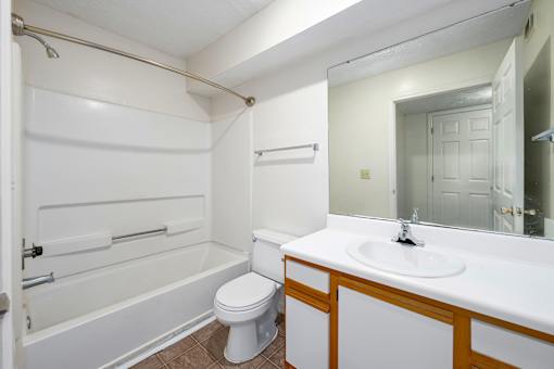 Full bathroom with tub at Arbours at Victoria Place Prattville AL