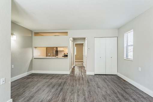 A room with a grey floor and white walls.