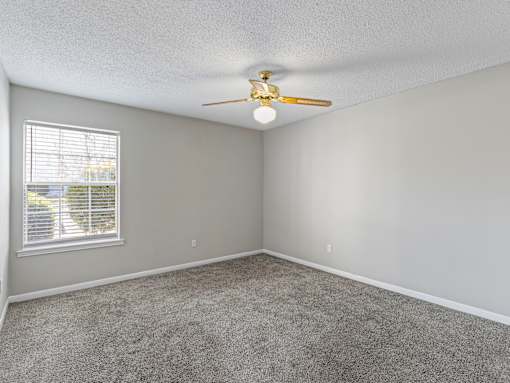 Carpeted room with ceiling fan at Park at Meadow Ridge Montgomery AL