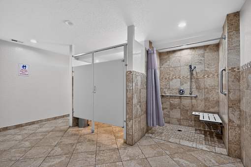 Bathroom at Renaissance at Carol Stream featuring a walk in shower and toilet in Carol Stream, IL.