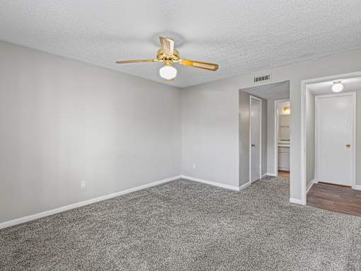 Room with carpet and ceiling fan at Park at Meadow Ridge Montgomery AL