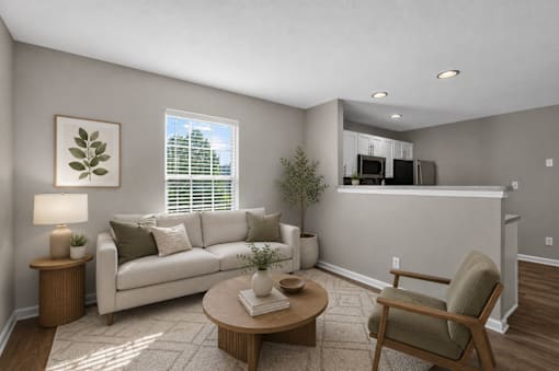 A living room with a couch, chair, and coffee table.