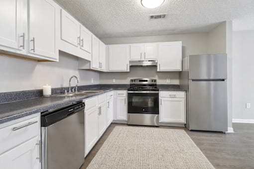 Bright kitchen with white cabinets at Avalon Place Columbia SC