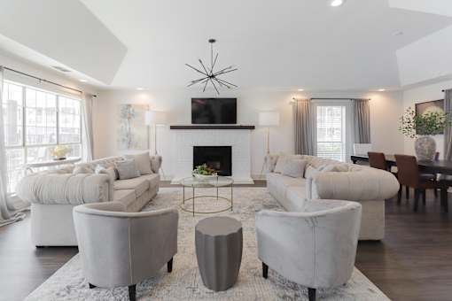 Community lounge with fireplace and TV at Park at Meadow Ridge Montgomery AL