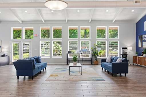 A living room with a blue couch and a coffee table.