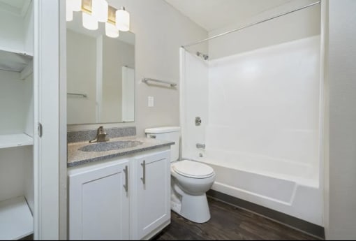 a bathroom with a sink toilet and a shower