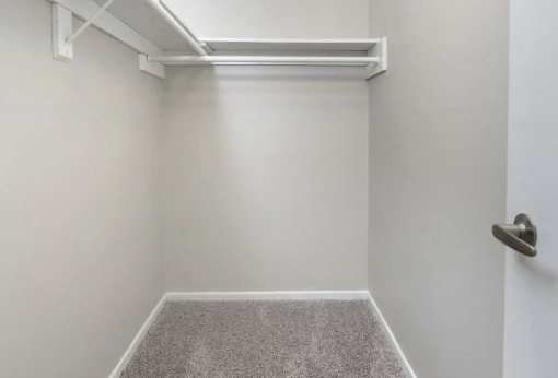 a empty room with a white wall and a door