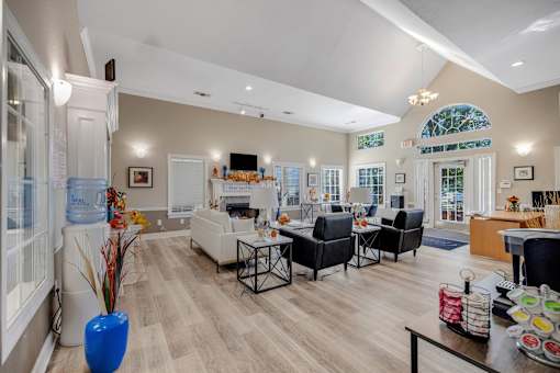 Welcoming community room with decorative blue vase on table at Cambury Hills Apartments in Omaha, Nebraska