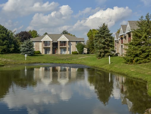 the view of a pond in front of a building