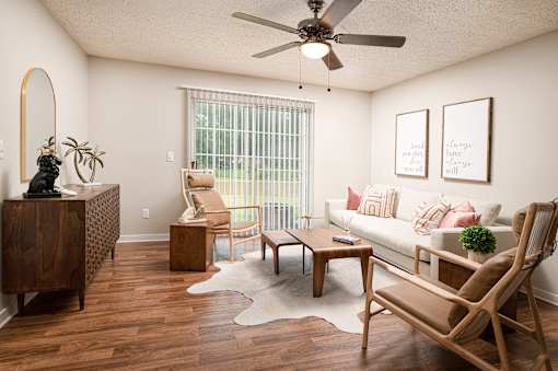 Bright living room with modern furnishings at Southwind Apartments in Richland, MS.