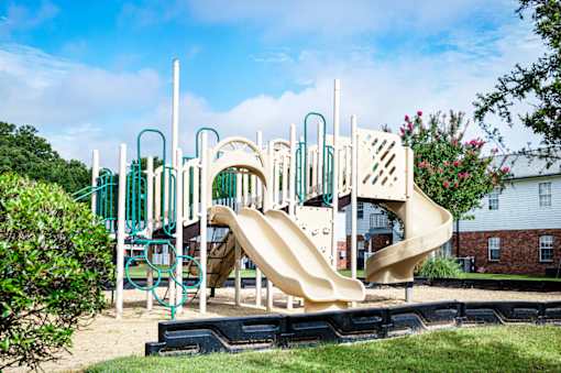 Community playground featuring a slide and climbing structures at Southwind Apartments in Richland, MS.