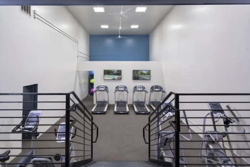 the waiting room of a hospital with a row of chairs