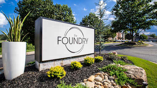 The Foundry sign is displayed in front of a landscaped area.