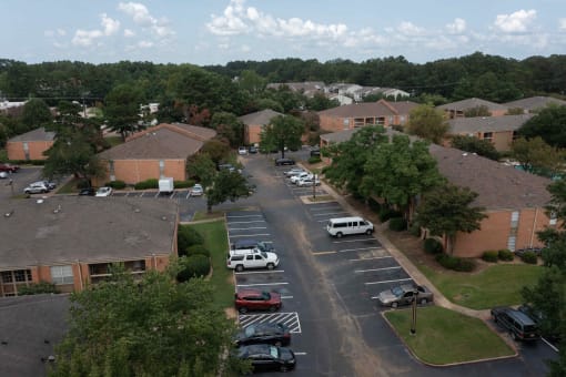 arial view of a neighborhood with brick buildings and trees