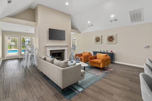 a living room with couches and a fireplace and a television