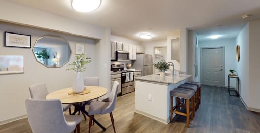 a kitchen and dining area in a 555 waverly unit