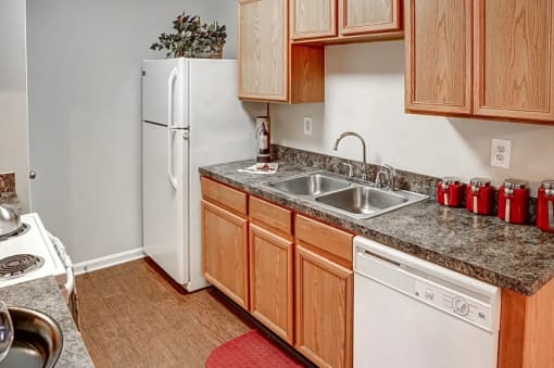 a kitchen with a sink and a refrigerator