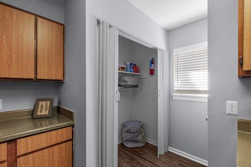 Kitchen with Pantry Access at Lakeland East Apartments – Flowood, MS