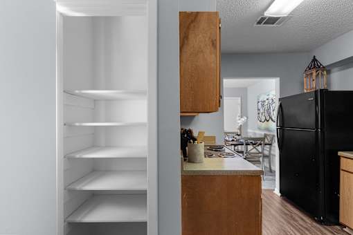 Functional Kitchen with Black Appliances at Lakeland East Apartments – Flowood, MS