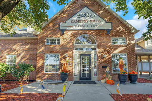 Front entrance of Cambury Hills Apartments brick building in Omaha, Nebraska
