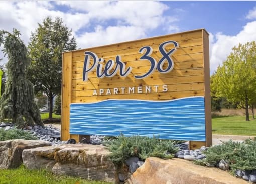 a sign for the pnr 33 apartments on the side of a road