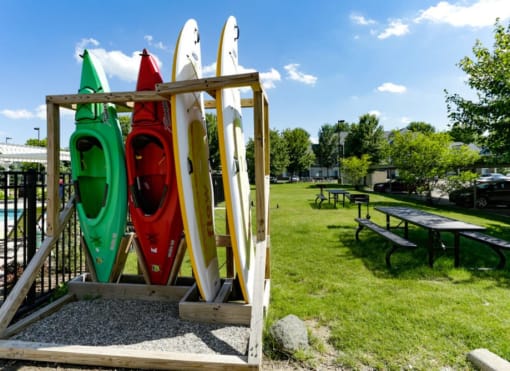 a childrens play area with a seesaw and a picnic table