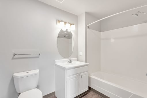 a bathroom with a sink toilet and a bath tub