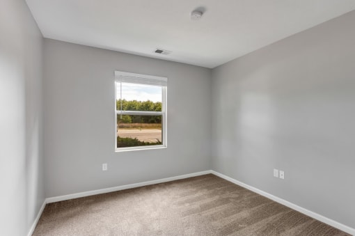 an empty room with a window in it