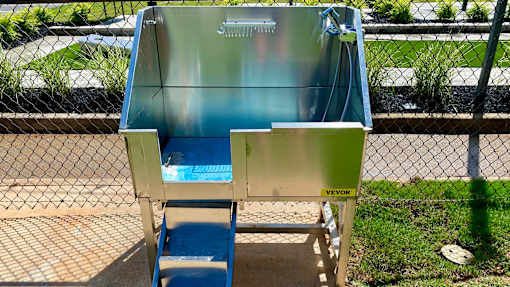 A blue and silver portable toilet with the word "VEVOR" on it.