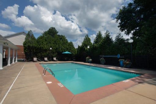a swimming pool in front of a building