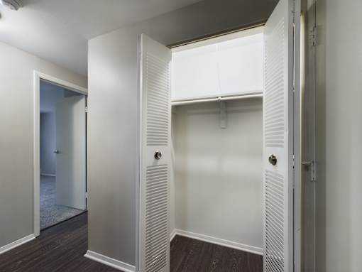 A white door with a handle is open.