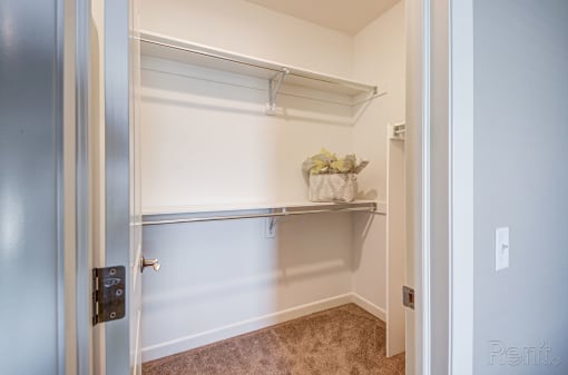a walk in closet in a 555 waverly unit