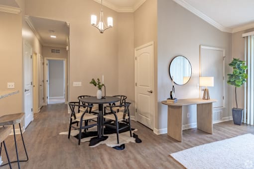a dining room with a table and chairs