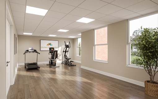 A room with exercise equipment and a sign that says  at Divinity Landing Apartments, Macedonia
