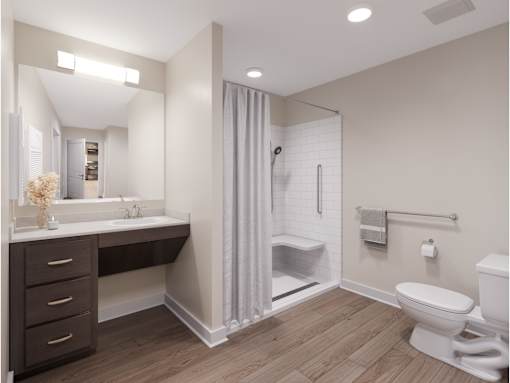 A bathroom with a white toilet and a walk-in shower. at Evergreen Heights Apartments, Toledo, 43614