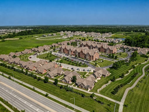A suburban neighborhood with houses and a road.