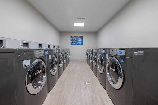 A row of washing machines in a laundromat.