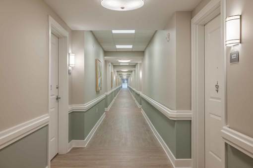 A long hallway with doors on both sides.