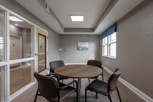 A conference room with a table and chairs at Sunday Village in Austin