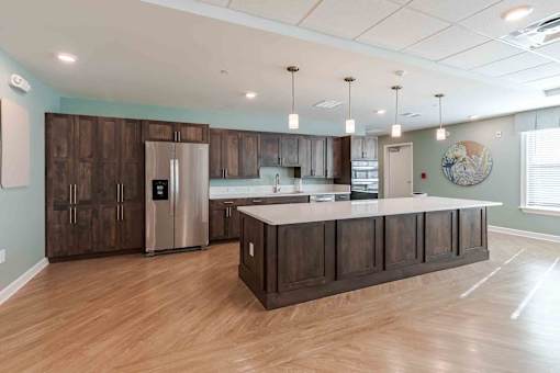 A kitchen with wooden cabinets and a white countertop.