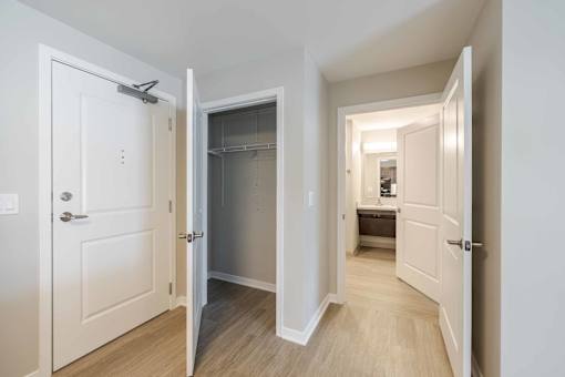 A white door is open to a hallway.