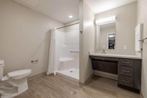 A bathroom with a toilet, sink, and bathtub.