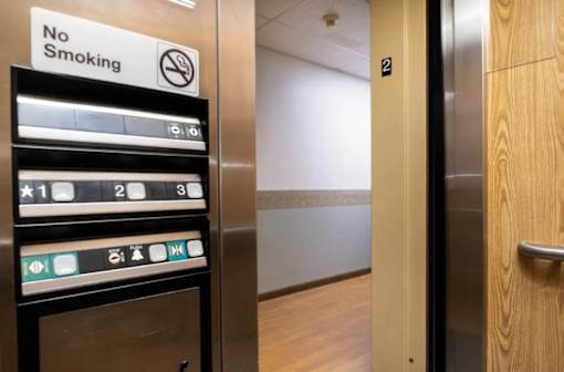 A sign on a shelf says No Smoking.