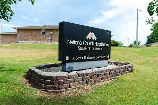 A sign for National Church Residences Summit Terrace, a senior residential community.