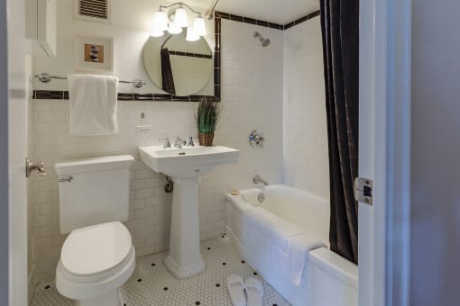 a bathroom with a toilet sink and bathtub