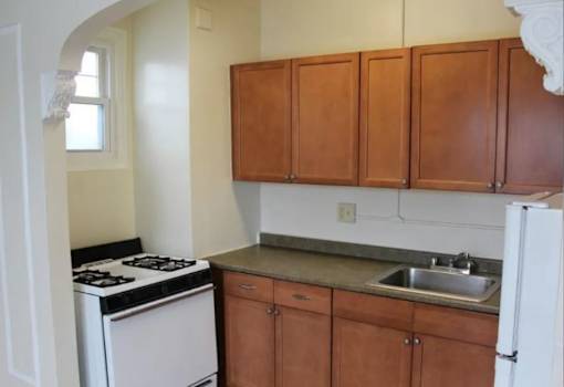 Kitchen with Wooden Cabinets at Lifestyle Apartments at Syracuse, Syracuse, NY, 13203