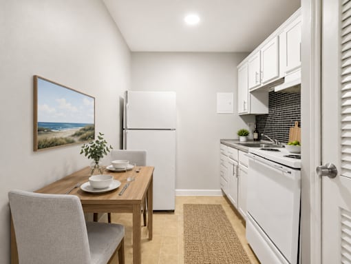 A kitchen with a table and chairs in front of a painting of a beach scene.